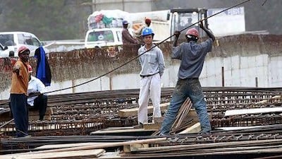 A Chinese contractor supervises construction of a new bridge on on the Nairobi-Thika highway project. Thomas Mukoya / Reuters
