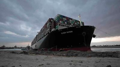 Tugboats and diggers work to free the ‘Ever Given’ container ship from the bank of the Suez Canal on March 28, 2021. Suez Canal Authority via AP