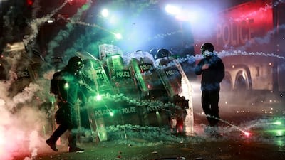 Police in Tbilisi advance on protesters rallying against the government's decision to suspend negotiations on joining the European Union for four years outside the Georgia parliament building on Saturday November 30. AP