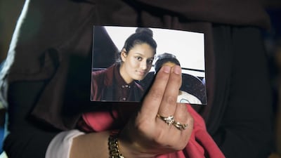 Renu Begum holds a picture of her sister Shamima Begum. AFP