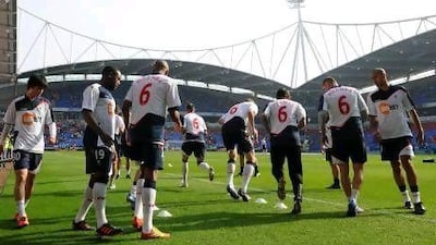 Bolton players warm up wearing "Muamba 6" jerseys prior to their home match against Blackburn.
