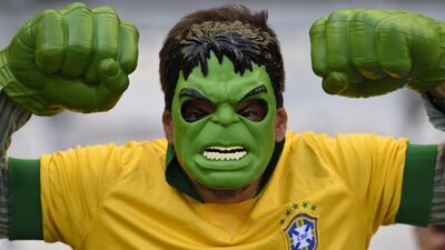 A Brazilian fan dressed as the Hulk waits for the start of the last 16 World Cup match between Brazil and Chile on Saturday in Belo Horizonte, Brazil. Fabrice Coffrini / AFP