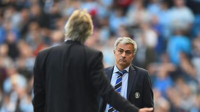 Jose Mourinho, right, of Chelsea speaks with Manuel Pellegrini of Manchester City during their Premier League match at Etihad Stadium on September 21, 2014, in Manchester, England. Laurence Griffiths / Getty Images