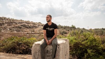 A Palestinian man outside a seam zone. Access to these Palestinian areas is controlled by an Israeli permit system. Tanya Habjouqa / Noor for The National