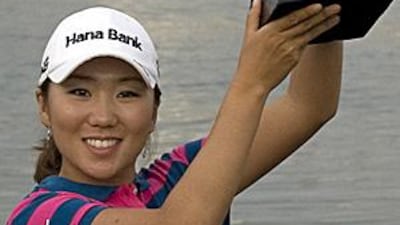 In Kyung Kim proudly holds the Dubai Ladies Masters trophy aloft after winning her third title of her career.