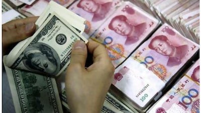 An employee counts U.S. dollar banknotes as yuan banknotes are seen at a branch of the Industrial and Commercial Bank of China in Huaibei, Anhui province in this May 25, 2010 file photo. China has ended its "crisis-mode" pegging of the yuan to the dollar with a statement that it will gradually increase the flexibility of its exchange rate, an adviser to the central bank Li Daokui told Reuters on Saturday. REUTERS/Stringer/Files (CHINA - Tags: BUSINESS POLITICS) CHINA OUT. NO COMMERCIAL OR EDITORIAL SALES IN CHINA *** Local Caption *** PEK16_CHINA-YUAN-ME_0619_11.JPG