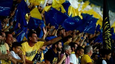 Frosinone's fans cheer and wave flags during the game against Juventus. AFP