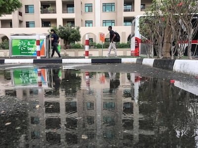 Puddles of water in the Greens were a sign of the rainfall that hit Dubai. Antonie Robertson/The National