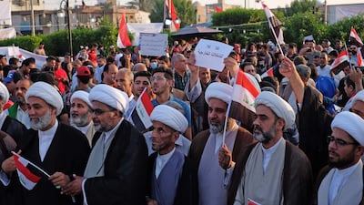 Iraqi Shiite clerics take part in anti-government demonstrations in Karbala city. AFP