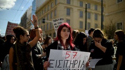 A placard in Greek about the rail tragedy reads '57 tickets for death'. AFP