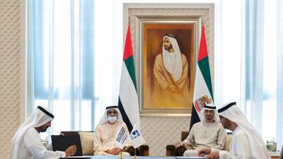 President Sheikh Mohamed and Sheikh Mohammed bin Rashid, Vice President and Ruler of Dubai, look on as Sheikh Ahmed bin Saeed and Dr Sultan Al Jaber sign the agreement. Photo: UAE Presidential Court