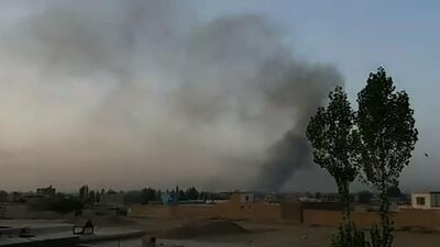 This screen grab taken from AFPTV video on August 10, 2018 shows smoke rising into the air after Taliban militants launched an attack on the Afghan provincial capital Ghazni, with terrified residents cowering in their homes amid explosions and gunfire. AFPTV