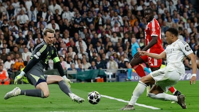 Real forward Kylian Mbappe sees a first-half shot saved by Bayern Munich goalkeeper Manuel Neuer. AFP