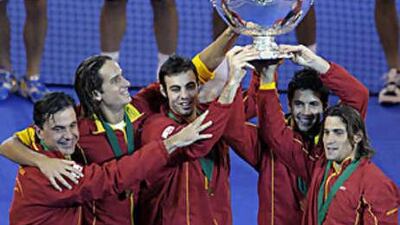 The Spanish Davis Cup team (from left to right) captain Emilio Sanchez Vicario, Feliciano Lopez, Marcel Granollers, Fernando Verdasco, and David Ferrer celebrate with the Davis Cup.