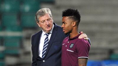 England manager Roy Hodgson talks with Raheem Sterling on Saturday before they played their Euro 2016 qualifier against Estonia on Sunday in Tallinn. Glyn Kirk / AFP / October 11, 2014