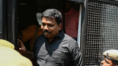 Robert Payas, who was convicted for his involvement in the assassination case of former Indian Prime Minister Rajiv Gandhi and was released in 2022, is escorted by police to apply for a passport at the Sri Lankan deputy high commission, in Chennai. AFP