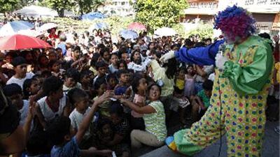 Mayon volcano evacuees are entertained by a clown at a public school turned into an evacuation centre in Legazpi City today.