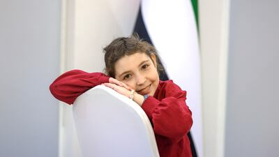 Now aged 13, Rahaf's cheeks have filled out, her hair has grown back and her smile has returned. Victor Besa / The National