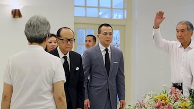Hong Kong billionaire Li Ka Shing, second from left, pays his respects to the late former prime minister Lee Kuan Yew at the Istana in Singapore on March 23, 2015. Lee, Singapore's first prime minister and architect of the tiny Southeast Asian city-state's rapid rise from British colonial outpost to global trade and financial centre, died early on Monday. Ministry of Communications and Information of Singapore/Handout via Reuters