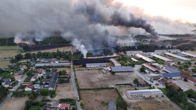 Smoke rises as firefighters try to extinguish a wildfire in Kolsa, Germany. Reuters