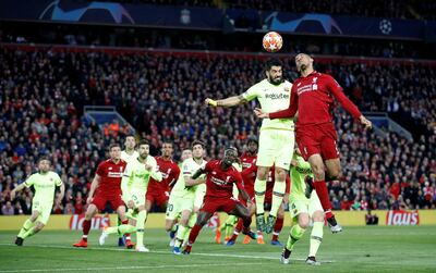Liverpool's Fabinho competes for the ball with Barcelona's Luis Suarez. Reuters