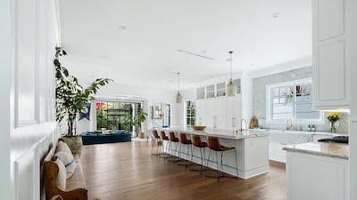 The kitchen's generously sized and sociable kitchen island offers ample space for socialising. Courtesy Engel & Volkers