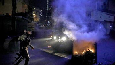 Lebanese soldiers reopen a road closed by protesters in Beirut's downtown district. AFP