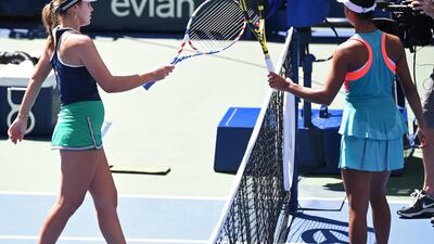 Sofia Kenin touches racquets with Leylah Fernandez of Canada (R) after their match. Reuters