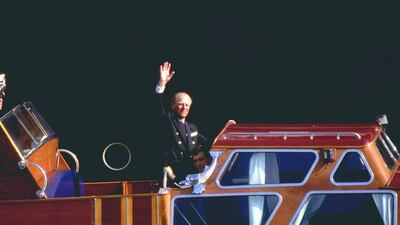 The Duke of Edinburgh waves to the crowd during Cowes week on the Isle of Wight in 1996. Stephen Munday/Allsport