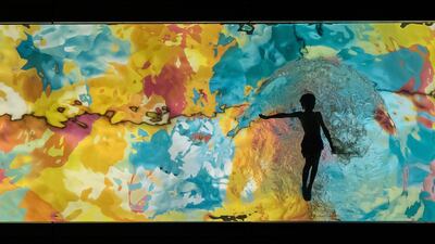 A young boy is silhouetted while swimming in a glass bottom pool 60 metres above street level, at a condo tower in Vancouver, British Columbia. AP