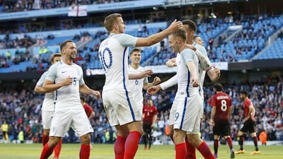Jamie Vardy celebrates with teammates after scoring the second goal for England. Action Images via Reuters / Carl Recine