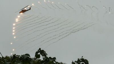 A US-made AH-1W Super Cobra helicopter launches flares during an annual drill at the military base in the eastern city of Hualien. Mandy Cheng / AFP Photo