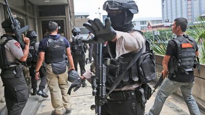 After the first explosions a gun battle broke out between the attackers and antiterror police squads, and gunfire could be heard more than an hour later. Tatan Syuflana / AP Photo