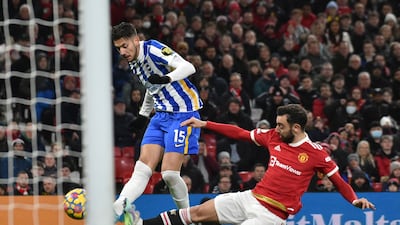 Brighton's Jakub Moder shoots at goal under pressure from Manchester United midfielder Bruno Fernandes. AP