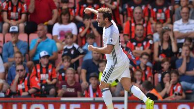 Manchester United midfielder Juan Mata celebrates scoring the opening goal during the Premier League football match between Bournemouth and Manchester United at the Vitality Stadium in Bournemouth, southern England on August 14, 2016. Glyn Kirk / AFP