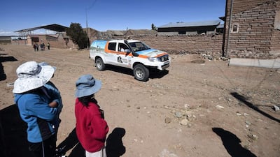 Dakar rally director Etienne Lavigne and staff ride through a village in Bolivia last week as they scout locations for the 2015 Dakar Rally. Franck Fife / AFP / September 16, 2014