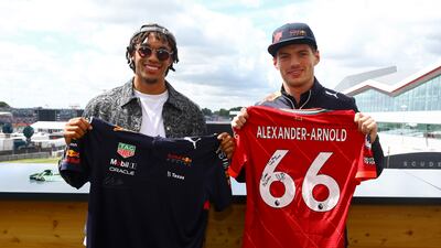 NORTHAMPTON, ENGLAND - JULY 03: Max Verstappen of the Netherlands and Oracle Red Bull Racing meets Trent Alexander-Arnold prior to the F1 Grand Prix of Great Britain at Silverstone on July 03, 2022 in Northampton, England. (Photo by Mark Thompson / Getty Images)