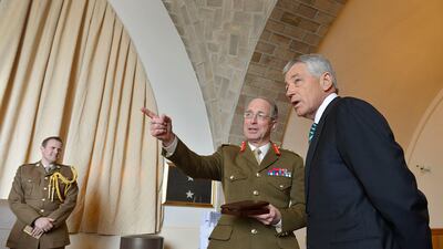 Tom Tugendhat is seen in the background as Gen Sir David Richards speaks to the US secretary of defense Chuck Hagel in 2013. Photo: DoD