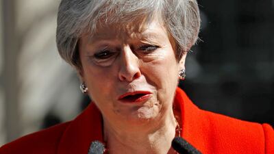 Britain's Prime Minister Theresa May reacts as she announces her resignation outside 10 Downing street in central London. AFP