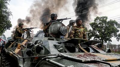 Army personnel patrol a street on an armoured vehicle after Awami League party activists allegedly clashed with security personnel to rebuke a rally by the newly formed Jatiya Nagarik Party, or National Citizen's Party in Gopalgan. AFP