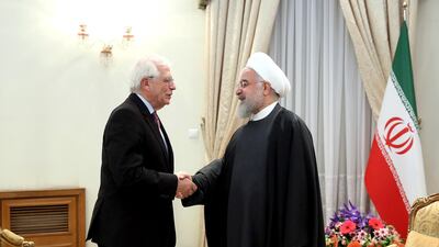 President Hassan Rouhani, right, welcomes European Union foreign policy chief Josep Borrell in Tehran AP