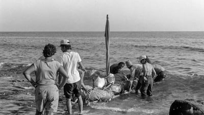 People launch a makeshift boat. These days Cubans making the trip make few political or media waves.