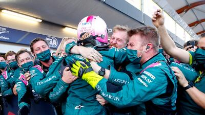 Aston Martin's Sebastian Vettel celebrates with his team after finishing second. Reuters