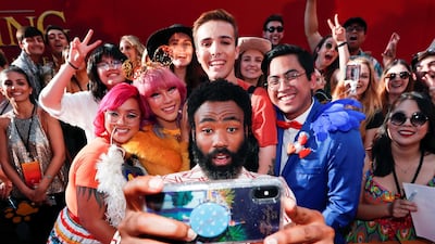 Donald Glover poses for a photo with fans during the world premiere of Disney's 'The Lion King' at the Dolby Theatre on July 9, 2019. Reuters