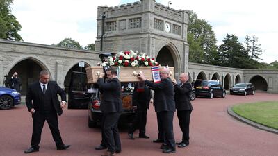 The coffin of British football legend Jack Charlton is carried into the West Road Crematorium. AFP