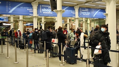 Travellers at Kings Cross St Pancras train station queue to board trains to Paris in London, Britain. EPA
