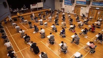 Pupils at Creative Secondary School in Hong Kong take the Diploma of Secondary Education exams. AFP