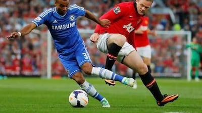 Chelsea defender Ashley Cole, left, turns under pressure from Manchester United striker Wayne Rooney at Old Trafford last night. Phil Noble / Reuters