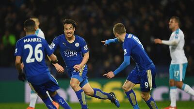 Shinji Okazaki of Leicester City (2L) celebrates with teammates as he scores their first goal with an overhead kick during the Premier League match between Leicester City and Newcastle United at The King Power Stadium on March 14, 2016 in Leicester, England. (Photo by Laurence Griffiths/Getty Images)