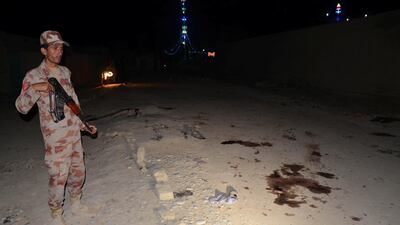 A Pakistani soldier stands guard after the suicide attack at a Shiite shrine in Jhal Magsi on October 5, 2017. Amir Hussain / Reuters